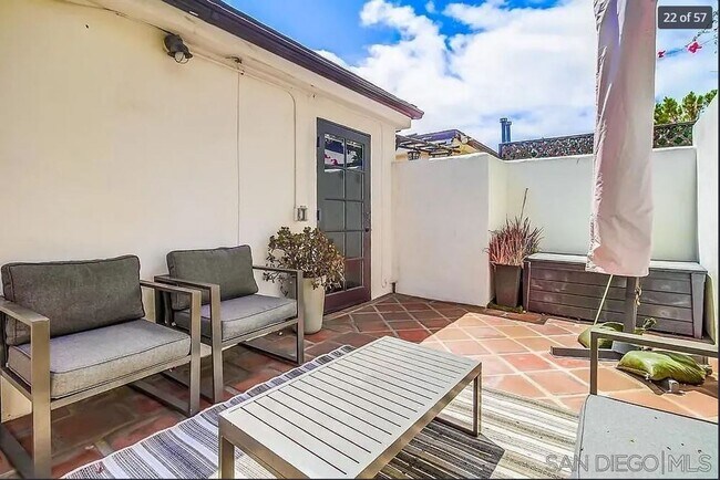 Building Photo - Charming, Fully Furnished Spanish-Style Du...