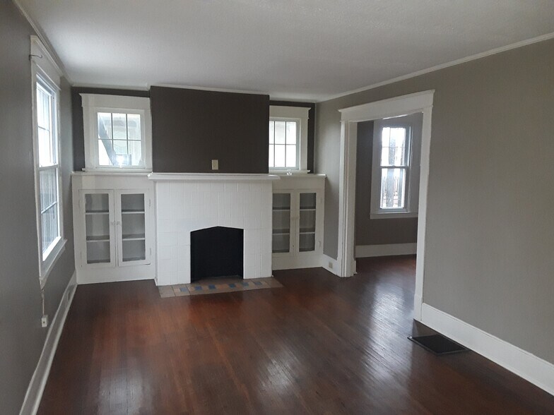 Living room with fireplace and built in cabinets - 4563 S 1st St