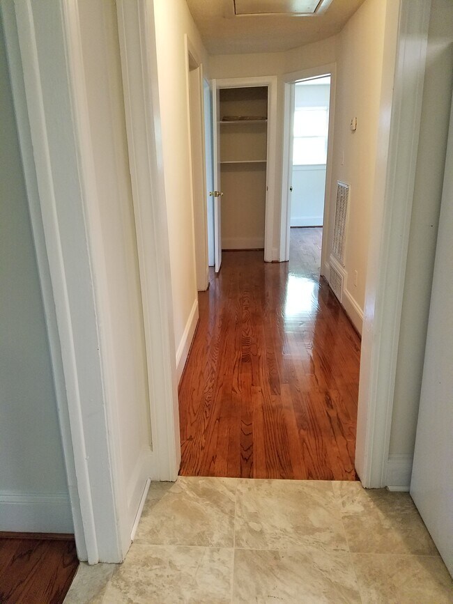 Hall view to 3 bedrooms & bath from Kitchen - 115 N Warren St