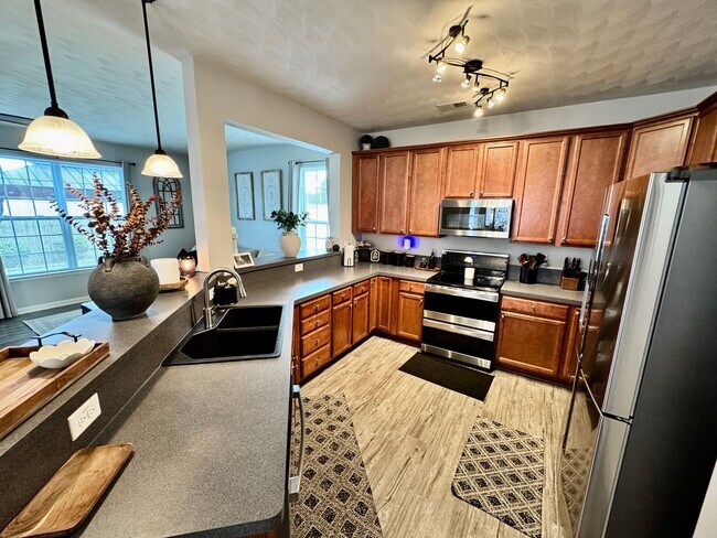 Building Photo - First-Time Rental, Available July 1st! Attached Garage - 2 Primary Suites - Pet-Friendly (Under 4...