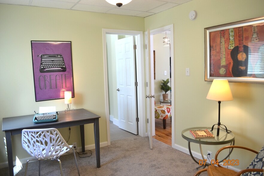 downstairs bedroom/den has a door to full bath - 222 W Peck St