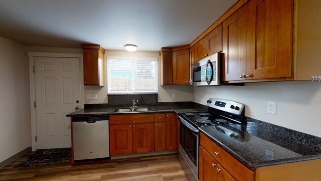 Building Photo - Charming 2 Bedroom Duplex - Granite Counters, Plank Flooring, Fully Fenced, Storage Shed!