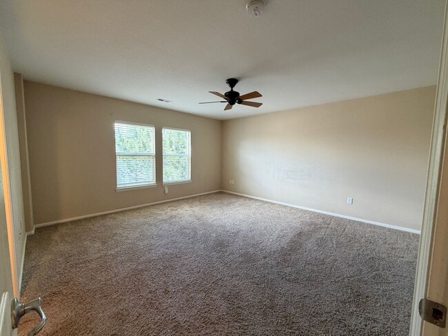 Building Photo - LEASING SPECIAL! Bright Open-Concept Condo with 1-Car Garage in Prime Commuter Location