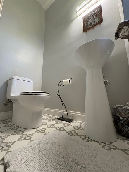 Powder room with marble mosaic tile - 5553 Little Falls Rd