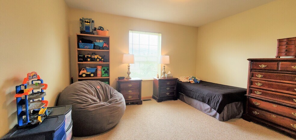 Bedroom 2/upper level. (photo from neighboring unit with the same layout) - 1756 St Joseph St