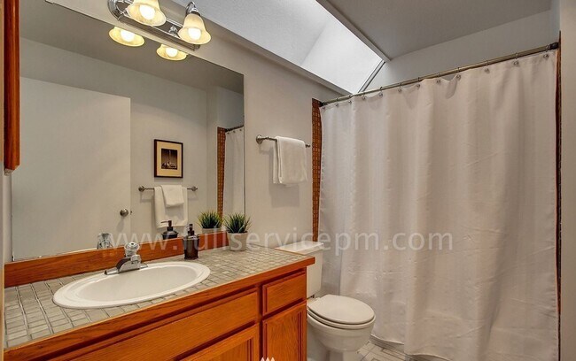 Building Photo - View Townhome Overlooking Genesee Park, Private Patio, Decks & Garage Parking