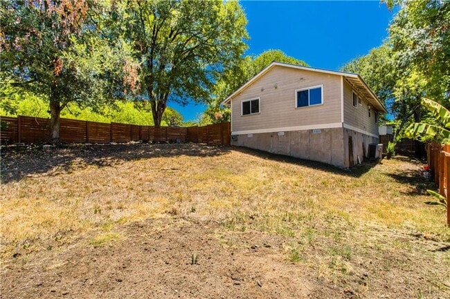 Building Photo - Stunning Renovation - New Hardwood flooring, tile in Kitchen. Granite countertops, breakfast bar
