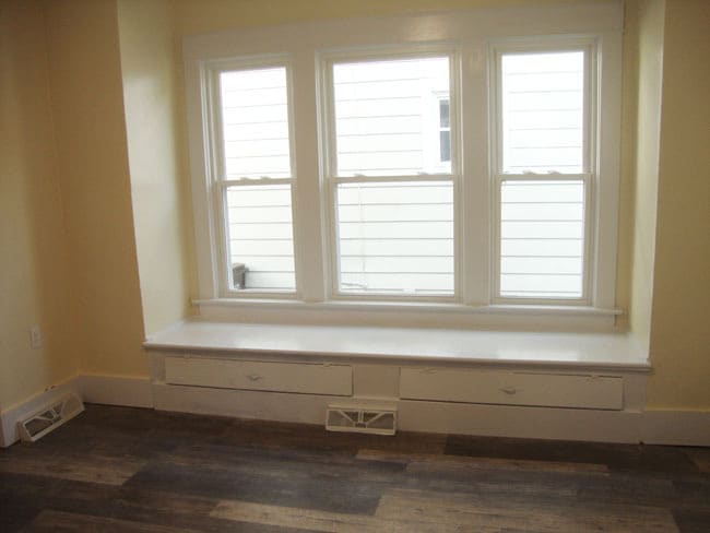 "Eat in" area of the kitchen. Exit to deck/rear entrance on the right. - 458 McConnell St