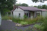 Building Photo - BISMARCK - 2BD/Fireplace/Metal Roof, Vinyl Siding/Iron Mt Lake ONLY - $399 MONTH / $695 DOWN