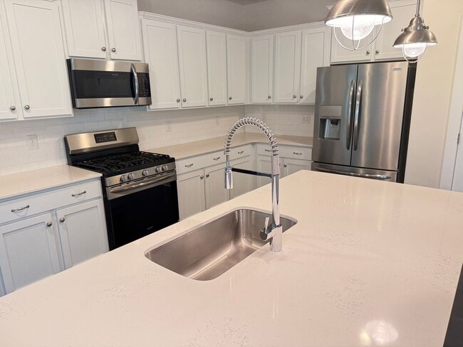Building Photo - Beautiful Westbranch Home with 2-Car Garage, Covered Porch & Greenway Entrance Across the Street