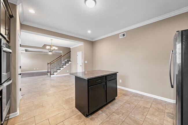 Building Photo - Four Bedroom with Three Car Garage!