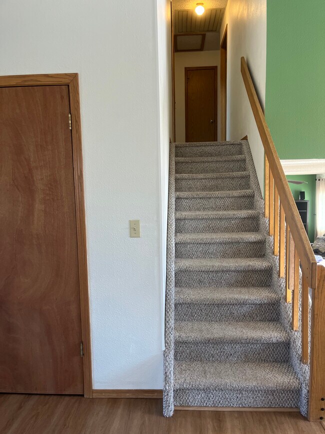 Coat closet and stairs up to 3 bedrooms and 2 full baths - 2619 15th Ave