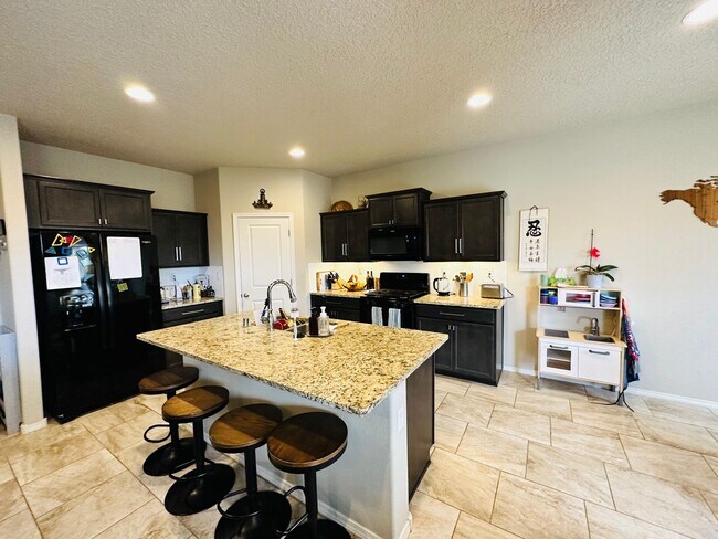 Building Photo - STUNNING Back yard!  Level II EV Charger!