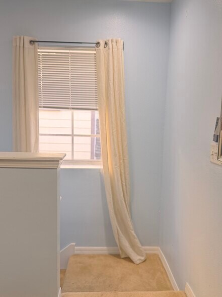 Living room with windows that let in natural light - 16131 Loneoak View Dr
