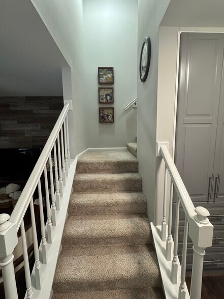 Carpeted Stairs towards Bedrooms - 401 Heritage Commons Cir