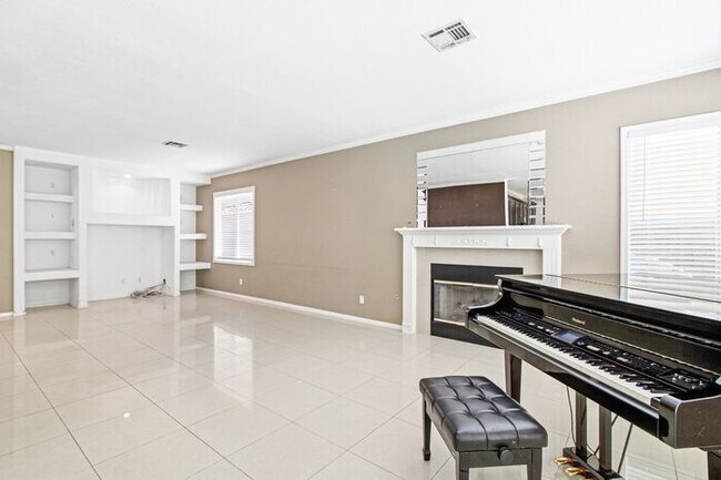 Building Photo - Spacious 4-Bedroom Home with Fireplace, 3-Car Garage & Great Backyard