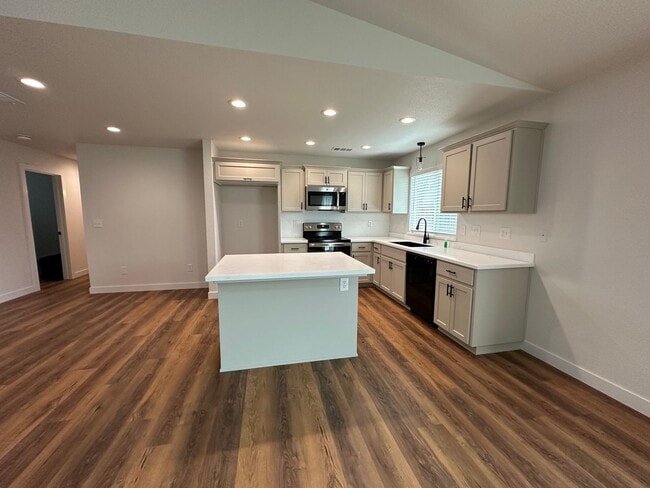 Building Photo - Updated Home with Island Kitchen, LVP Flooring, and Yard Care Included!