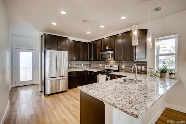 Building Photo - "Charming 2-Bed, 2-Bath Home with Gleaming Hardwood Floors in Vibrant Denver!"