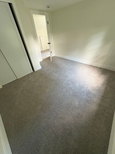 One of the upstairs bedrooms - carpeted throughout second floor! - 117 Green Ln