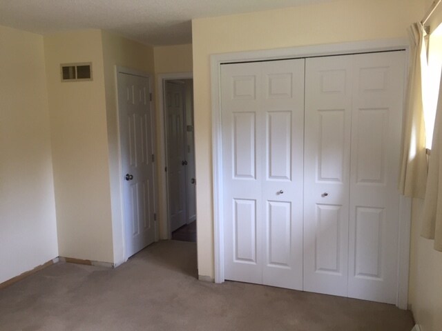 Large back bedroom with two closets. - 12601 Blue Ridge Ext