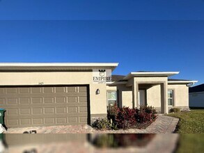 Building Photo - COMING SOON! 3 Beds + Den, 2 Baths, Screened Lanai & More!