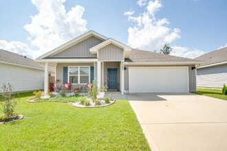 Building Photo - 4-Bed, 2-Bath Home in Woodlands Subdivision with Solar, Open-Concept Living, Modern Kitchen, Fenc...