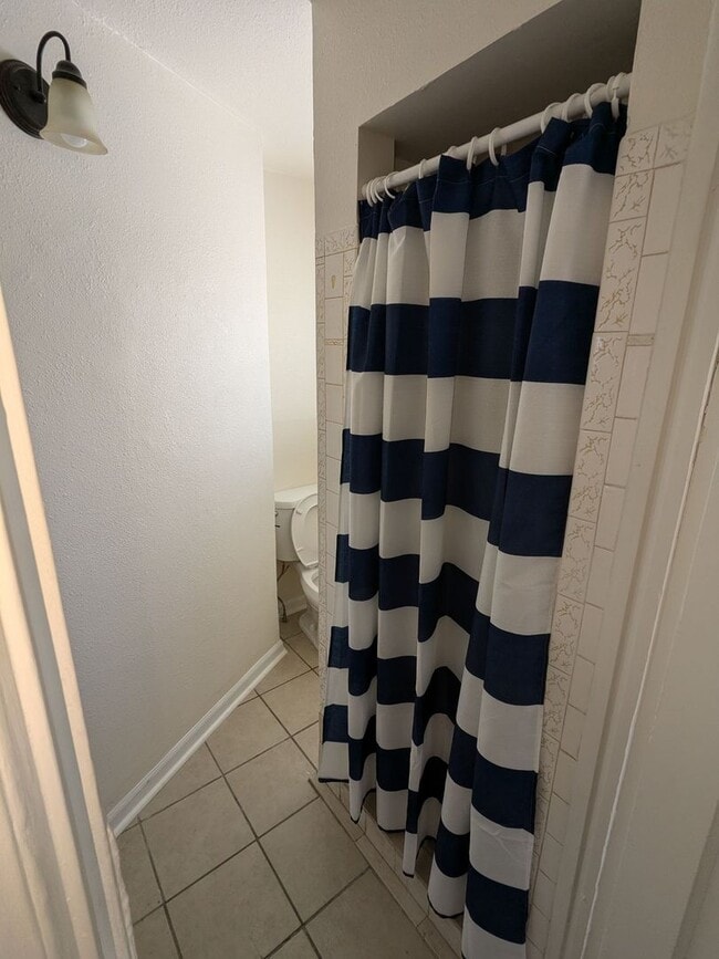 Building Photo - Ground Level 2 Bedroom, 2 Bath apartment. New flooring and paint. Tenant pays electric and natura...