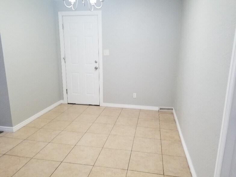 Entrance from Attached Garage to Dining Area - 7141 Quivas