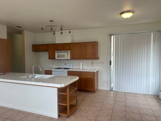 Building Photo - 4 Bedroom, 2 Bathroom Home with a Pool in ...