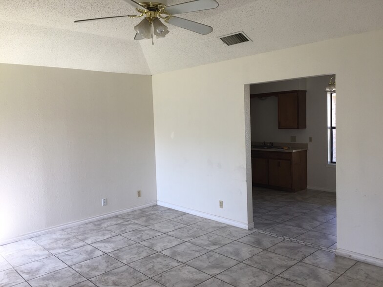 Living room view to kitchen/dining (prior to repaint) - 613 Van Zandt St