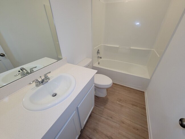 Building Photo - This single-story home has a comfortable layout with three bedrooms and a living area all on one ...