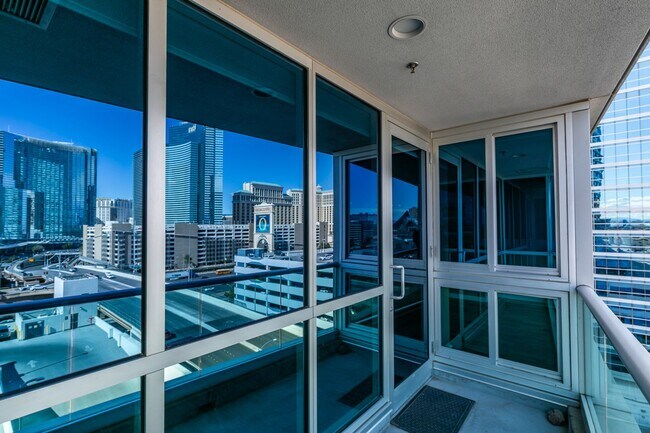 Building Photo - Iconic Strip-View Luxury | Elegant 1BR + Den High-Rise Residence