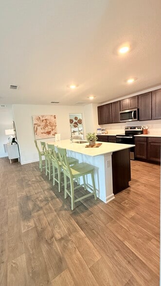 Picture of model home. The home has white cabinets - 16 Summerwood Rd S