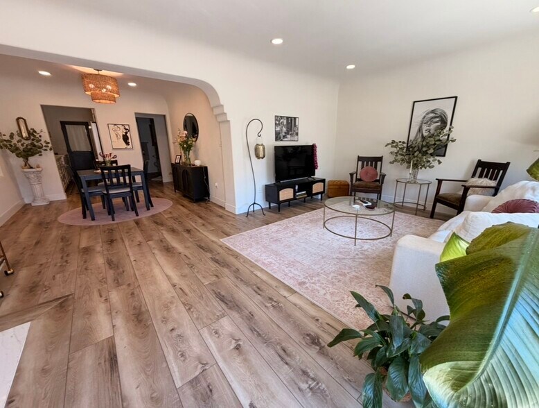 Open-concept living room and dining room. - 726 Cohasset Ct