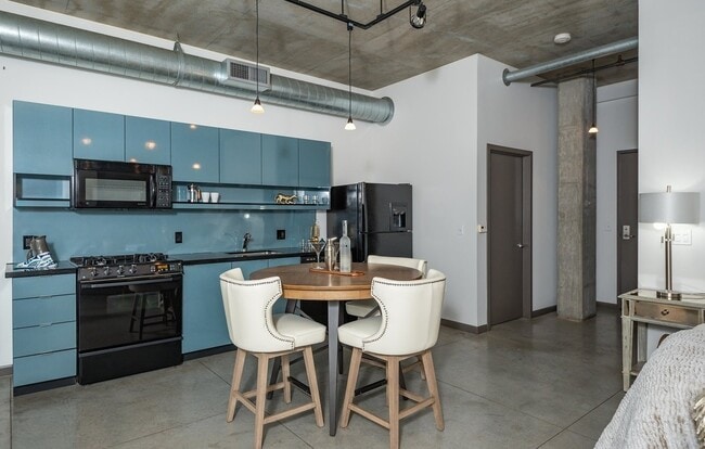 Building Photo - 1/2 Month FREE: Rare Streetcar Lofts Gem w/ Parking & Utilities