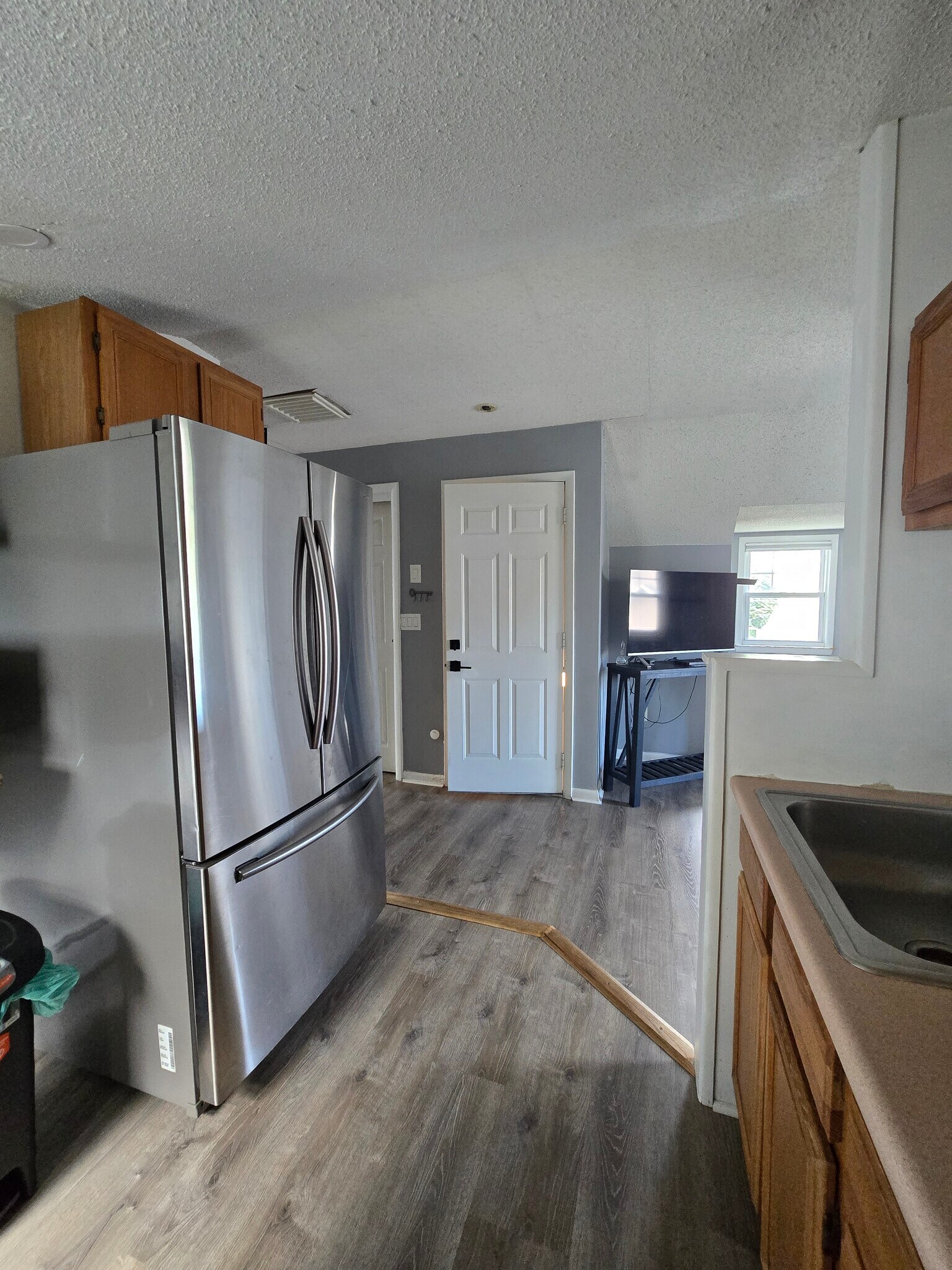 Kitchen and door exit - 69 Post Pl