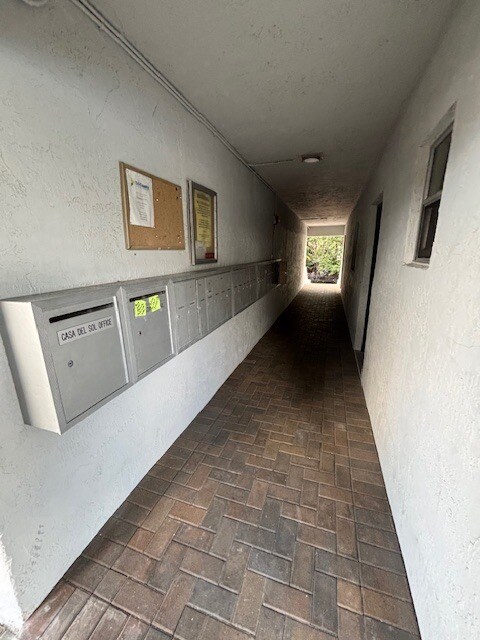 View of Hall with Mailboxes and Steps to Dock/Canal - 1400 NE 57th St