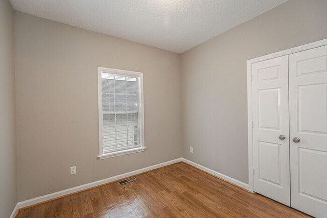 Building Photo - Like New Home off Freeman Mill. Just Painted, New Wood/Vinyl Flooring, Vaulted Ceilings, Front Po...