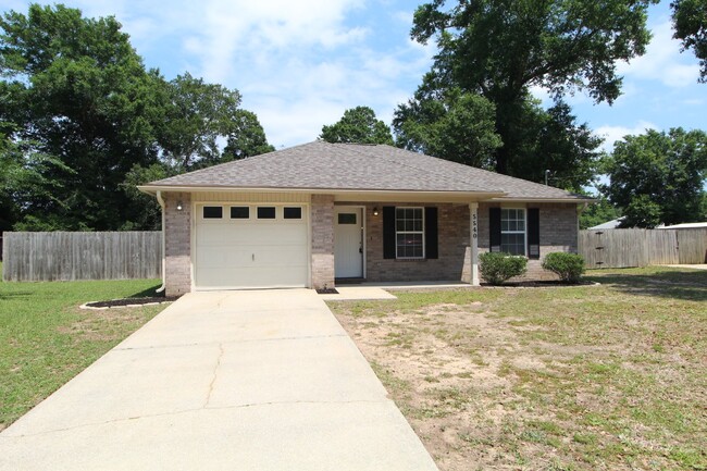 Building Photo - "Spacious 3-Bedroom Brick Home with Fenced...