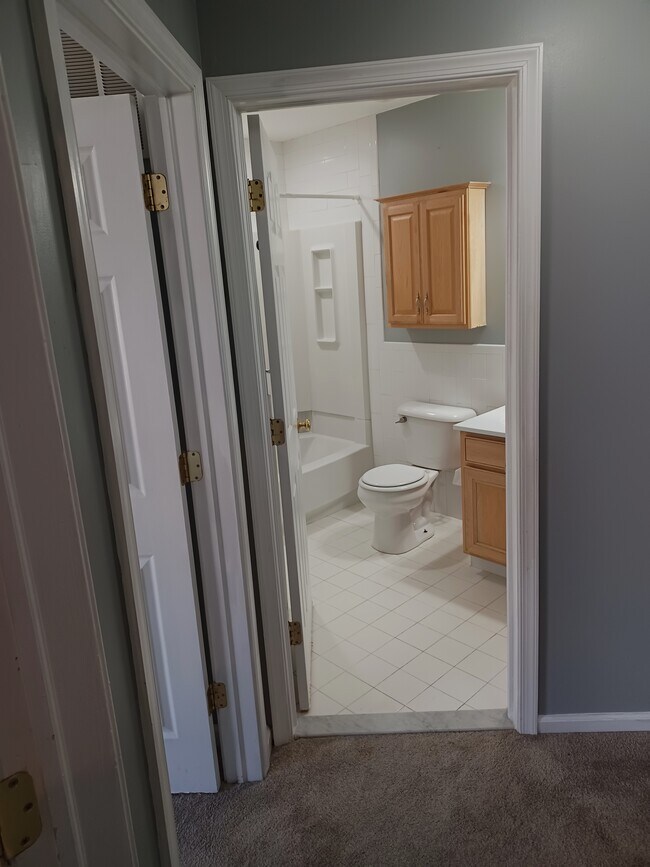 Spacious hall bath with tub/shower, and storage cabinet - 116 E Moreland Ave