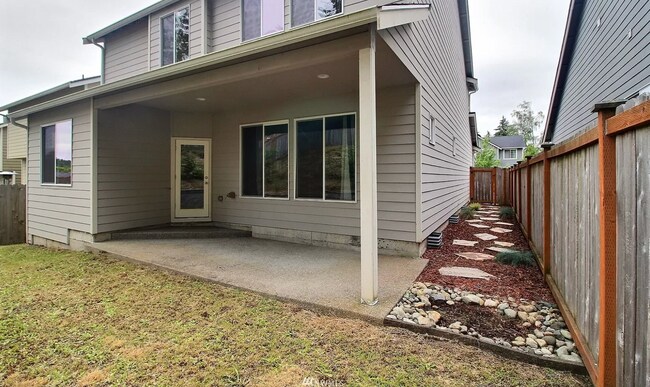 Backyard with Backside of House - 596 NE Nantucket St