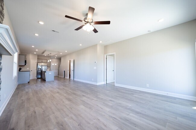 Building Photo - Elegant Home with Stone Fireplace, Kitchen Island and Designer Primary Suite