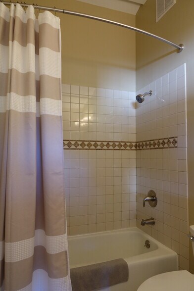 Full-size bathroom includes a combination shower bathtub - 2620 Tallant Rd