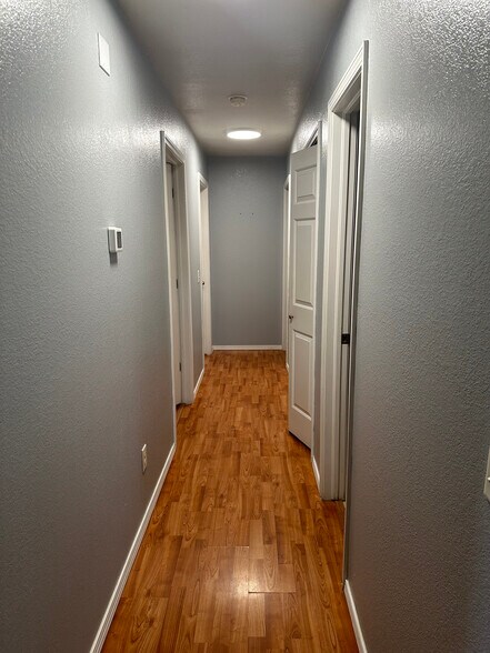 Main hallway with laundry on right - 1004 Shadowlake Rd