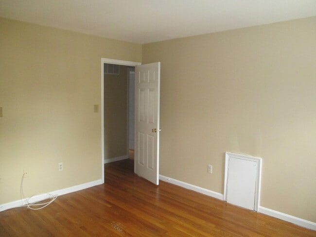 Building Photo - SPACIOUS BRICK TOWN-HOME