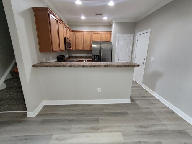 Building Photo - BRAND NEW FLOORING & FRESH PAINT - 3 Bedroom/2.5 Bath Townhome with garage in Wild Wing!