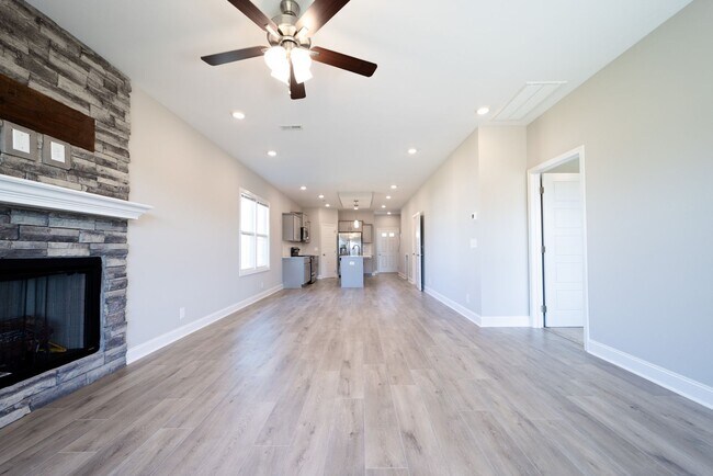 Building Photo - Elegant Home with Stone Fireplace, Kitchen Island and Designer Primary Suite