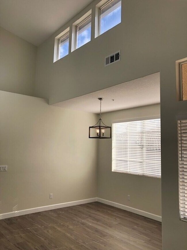 Building Photo - PICTURE PERFECT 2 BR/2 BATH PLUS LOFT END UNIT CONDO WITH DIRECT ACCESS 2 CAR GARAGE