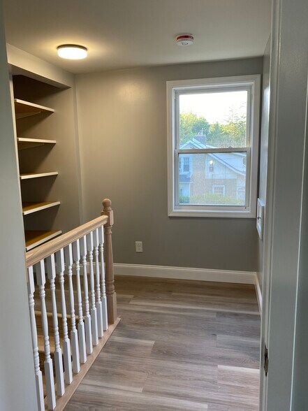 Bright upstairs hallway. - 3054 S Pike Ave