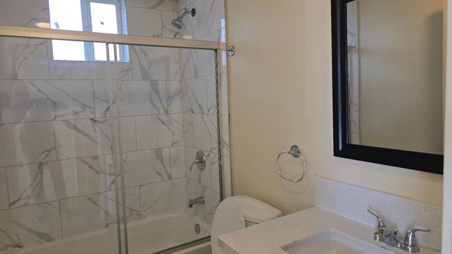 Building Photo - All Bed& Bath at 1st ,2 car Assigned Parking Space at back with access alley,tile &laminate floor...